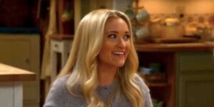 emily osment s mandy smiles at the dinner table in georgie mandy s first marriage episode 11