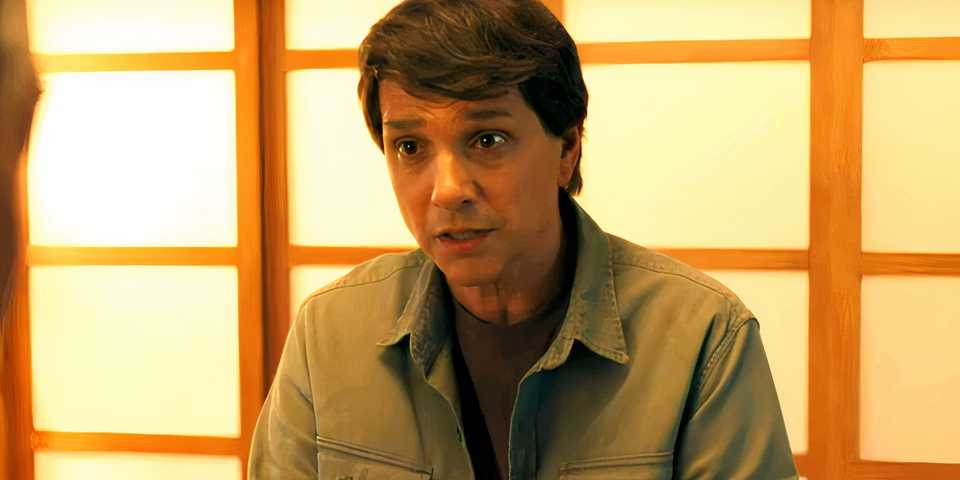 daniel is looking at mr han in karate kid legends